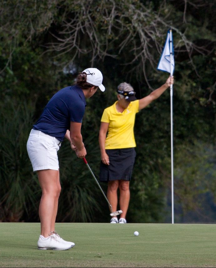 two women on a putting green
